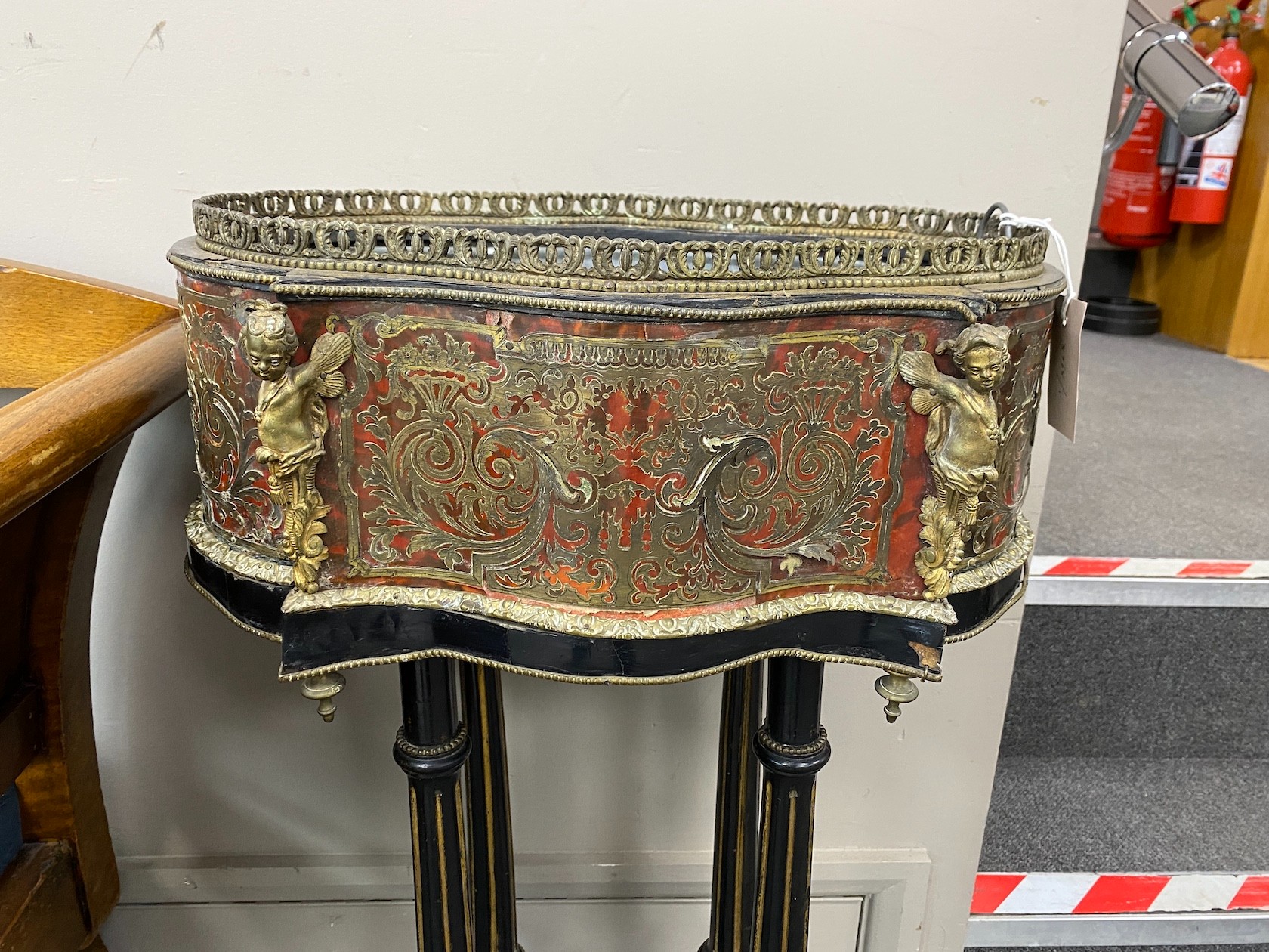 A 19th century boullework jardiniere, now on fluted ebonised stand, width 46cm, depth 33cm, height 90cm